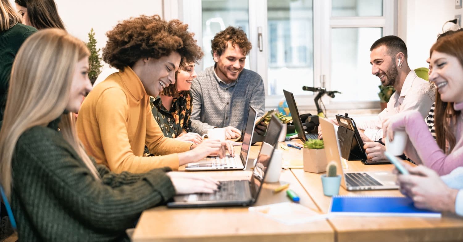 Gen Z and Millennials at an office table