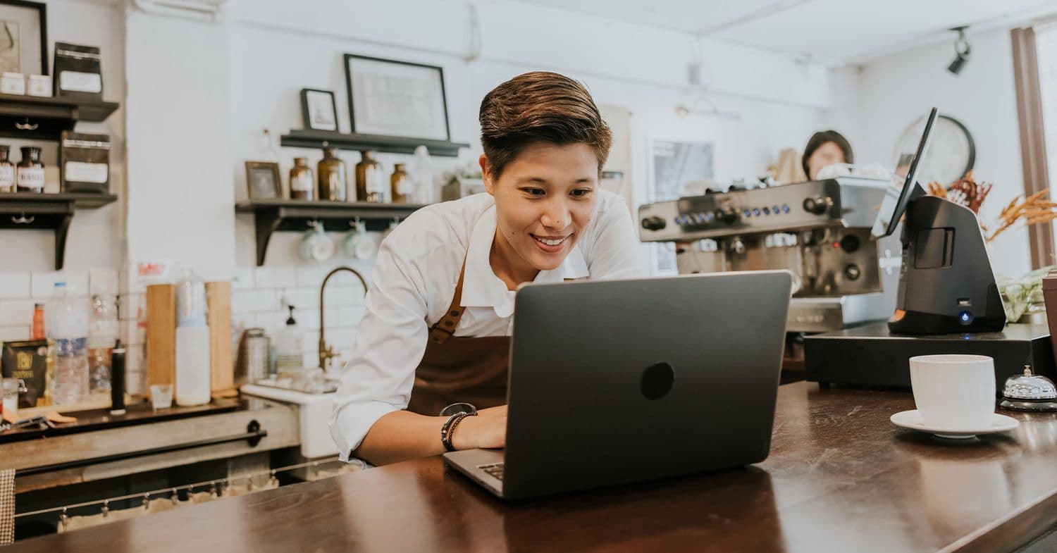 Woman on laptop working at Coffee Shop