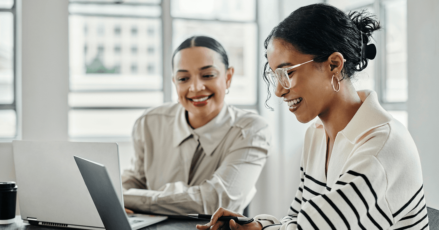 Two women looking at website audit